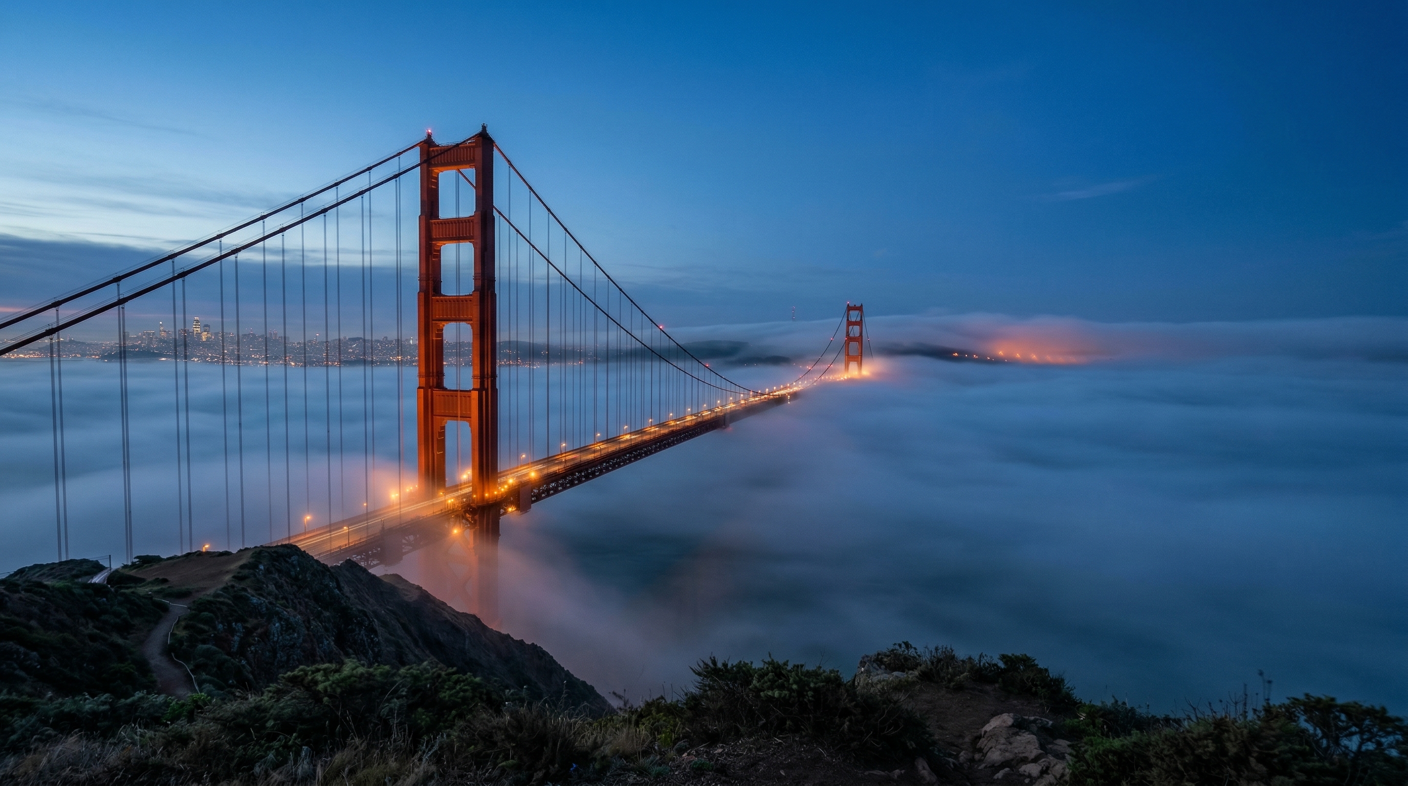 Golden Gate Bridge at blue hour with fog